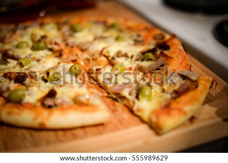 Pizza With Mushrooms, Olives And Cheese