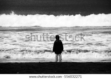 The boy looking at a winter sea/I took a picture at a beach in Japan Kanagawa-ken Oiso-machi in January