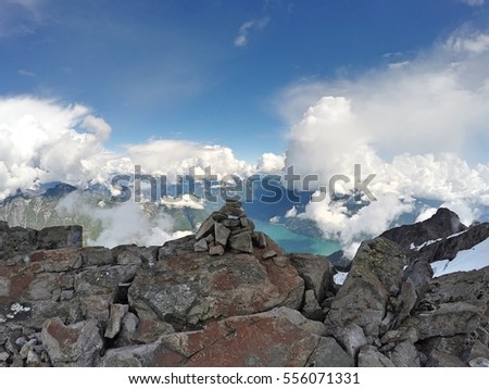 Cairn on Mount Robie Reid summit, Garibaldi Ranges, Mission, Stave Lake, British Columbia, Canada Royalty-Free Stock Photo #556071331