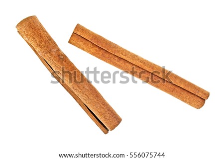 Two cinnamon sticks isolated on white background Royalty-Free Stock Photo #556075744