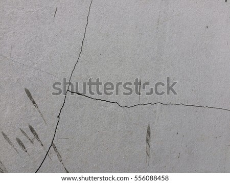Cracked cement wall background and texture