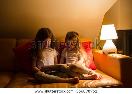 children sit and watch cartoons on your tablet