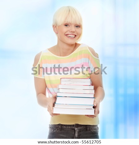 Young caucasian woman (student) with books.Over abstract blue background