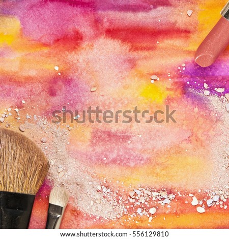 Makeup brushes and lipstick on a vibrant yellow and purple background, with traces of powder and blush. Square template for makeup artist's business card or flyer design, with plenty of copyspace