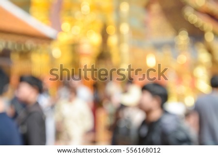 Blurred motion of people walking around  temple, Chiang Mai Thailand