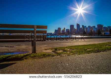 Bench, the Sun & Downtown of Vancouver - Canada