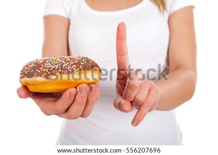 Close up picture of a woman holding a doughnut