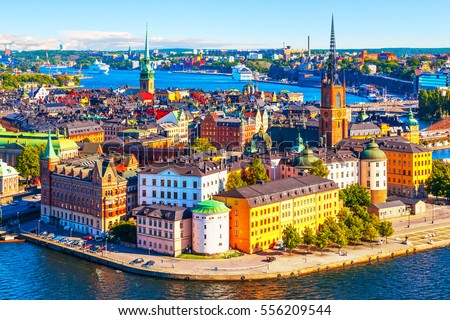 Scenic summer aerial panorama of the Old Town (Gamla Stan) pier architecture in Stockholm, Sweden Royalty-Free Stock Photo #556209544