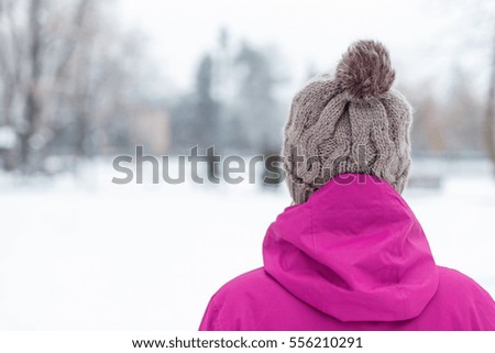 Picture of a woman walking outdoor in the snow