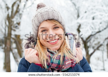 Picture of a young woman being cold outside on wintertime