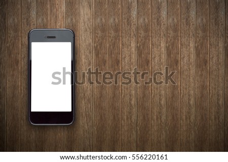 Blank screen  phone on wooden background.Photo with copy space.