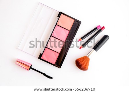 Makeup products on white background. Royalty-Free Stock Photo #556236910