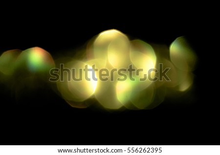 Soft colorful bokeh background. Luminous garlands of electric lights. Copy space to add text. Saturated colors. Blurry abstraction. Gentle tone. Dark night. Festive party in city. Defocus effect.