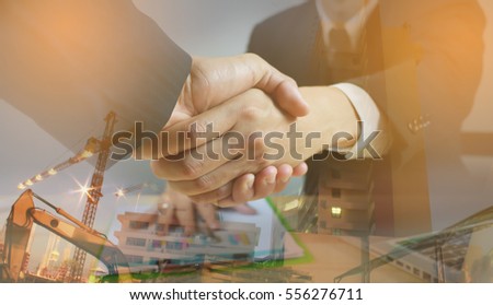 Success business The construction ,business concept,Double exposure of handshake ,Business handshake and business people,Together,businessman and ,selective focus,vintage color