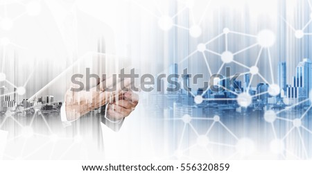 Double exposure businessman working on digital tablet with modern city, network communication technology concepts