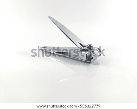 Nail clipper isolated on white background with reflection