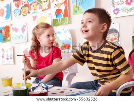 Children painting in art class. Child development.