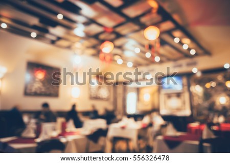 Chinese restaurant decorated for new year celebration in bokeh with retro film filter effect, defocused background