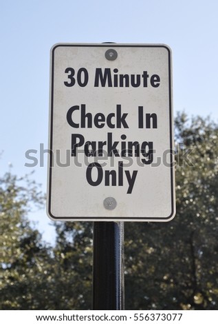30 minute check in parking only sign