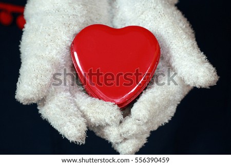 Red Heart on hands Wearing white gloves
For a Valentine's Day