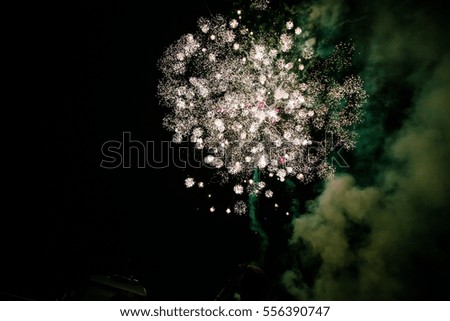 Colorful Fireworks background light up the night dark sky with dazzling display, 4th of July, New Year celebration fireworks isolated, sparkles, stars and twinkles. The end of the Festival