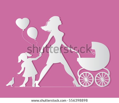 Mom with daughter and baby in carriage. Little girl feeds b