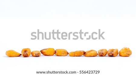  Roasted corn seeds in a row. picture in a studio