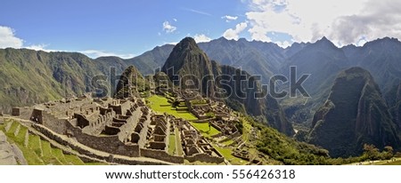 Panoramic view of the Machu Picchu archaeological site. Cusco, Peru. Royalty-Free Stock Photo #556426318