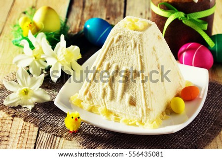 Easter background. Traditional Easter holiday table: cake, Easter and colorful Easter eggs. Toned image.