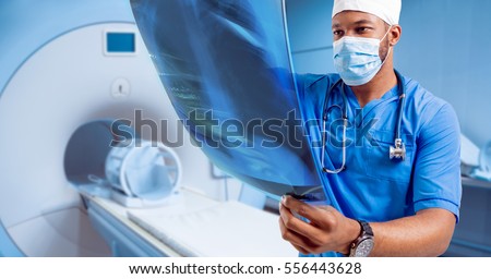 Doctor looking MRI picture. Medical equipment.