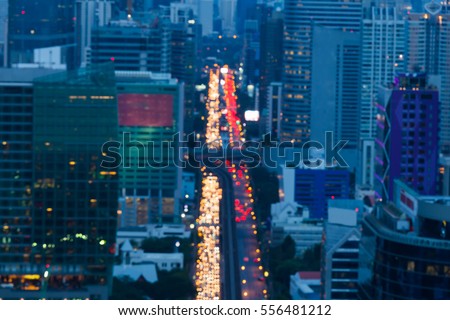 Aerial view, blurred lights city road Bangkok city downtown night view, abstract background