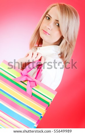 Blond girl with shopping bag