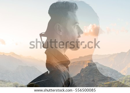 Triple exposure portrait of a businessman combinated with beautiful mountain landscape on the sunset Royalty-Free Stock Photo #556500085