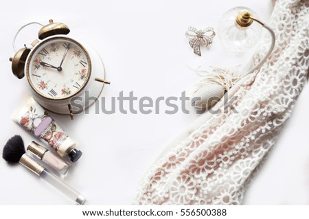 Retro alarm clock with vintage Perfume Bottle and girls accessories