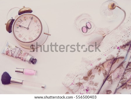 Retro alarm clock with vintage Perfume Bottle and girls accessories