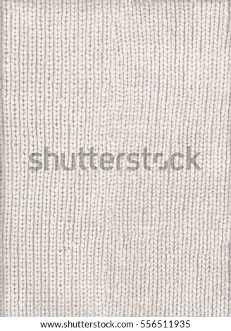 White knitted fabric texture. Wool sweater texture close up