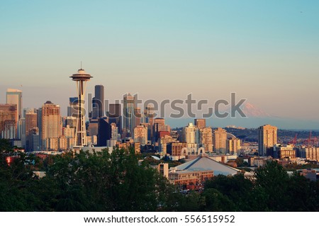 Seattle city skyline with Mt Rainier at sunset with urban office buildings viewed from Kerry Park.