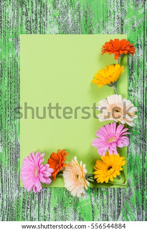 Holiday card with clean sheet of paper ant gerbera flowers, for your creative design