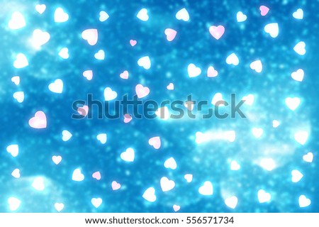 Blue abstract Valentines Day festive background and heart bokeh, glitter or circles lights with hearts. Round  defocused particles