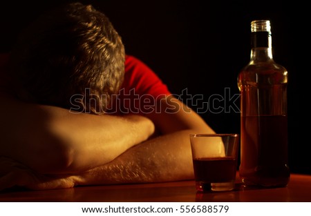Young man abuses alcohol. Alcohol dependence