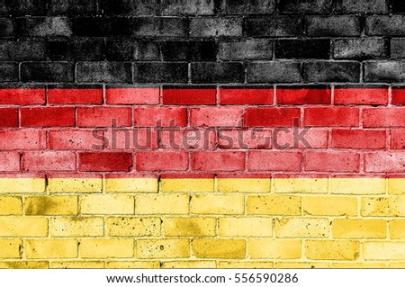 Brick wall with painted flag of Germany.