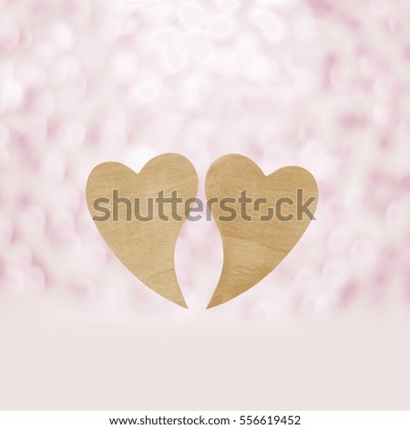 Two wooden hearts on a wooden background. Top view. Valentines days. Love symbol. Greeting card.Vintage style. Greeting card.