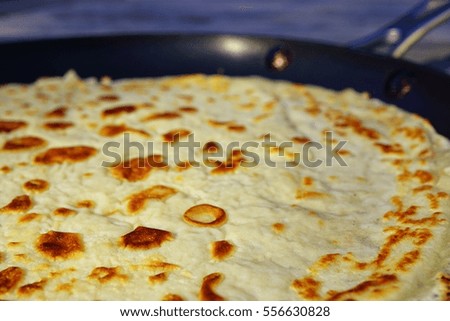 Close-up of the surface of a French crepe just cooked in a flat pan