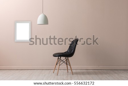 cream wall empty interior nordic decoration lamp and black chair concept, frame