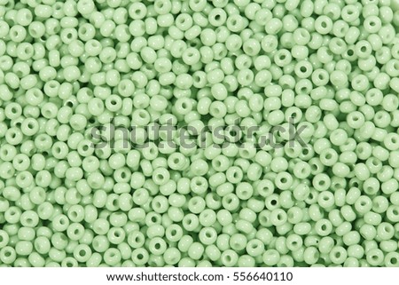 Close up of pale green seed beads