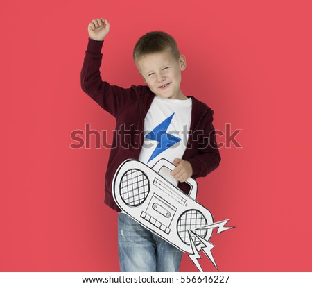 Caucasian Little Boy Holding Jukebox