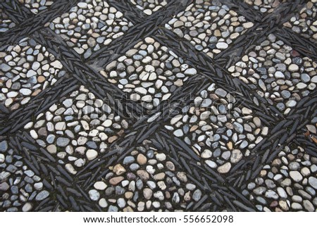 Black sea stones pavement / pebble  background