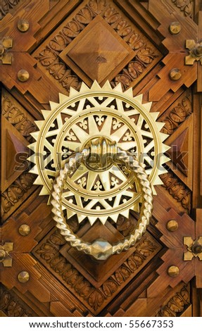Vintage image of ancient door knocker  on a wooden door. Royalty-Free Stock Photo #55667353