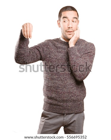 Happy young man doing a gesture of show