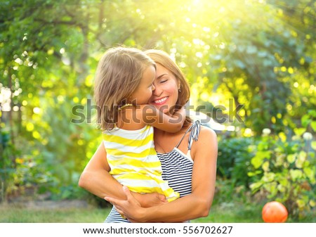Beautiful Mother And her little daughter outdoors. Nature. Beauty Mum and her Child playing in Park together. Outdoor Portrait of happy family. Happy Mother's Day Joy. Mom and Baby.